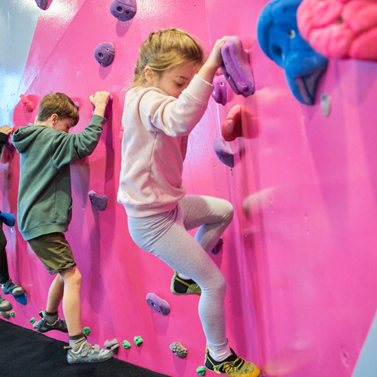 A trio of climbers hit the wall together