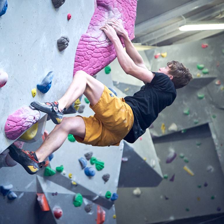 A child bouldering at The Climbing Hangar