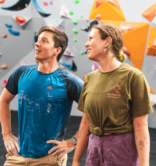 A male and female looking at a bouldering wall at The Climbing Hangar Exeter