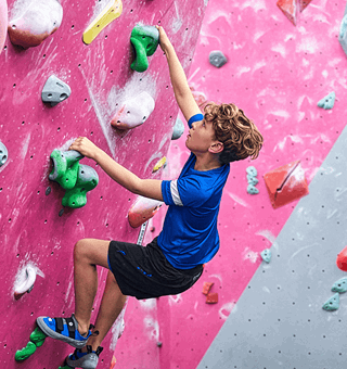 A child bouldering at The Climbing Hangar