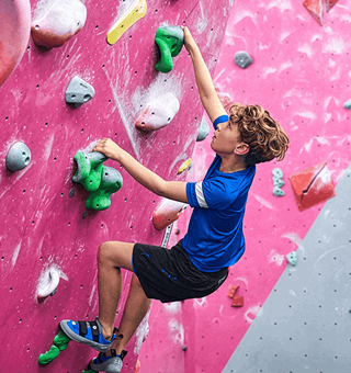 A child bouldering at The Climbing Hangar