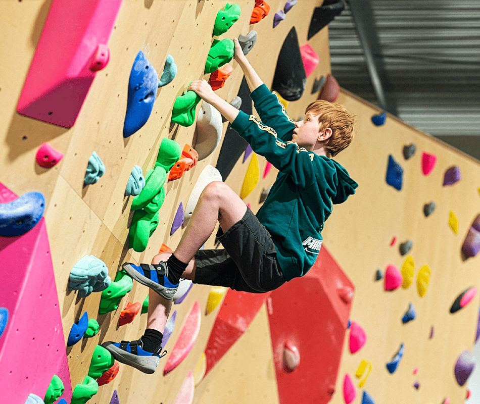 A child bouldering at The Climbing Hangar