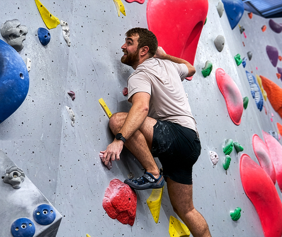 A man bouldering at The Climbing Hangar