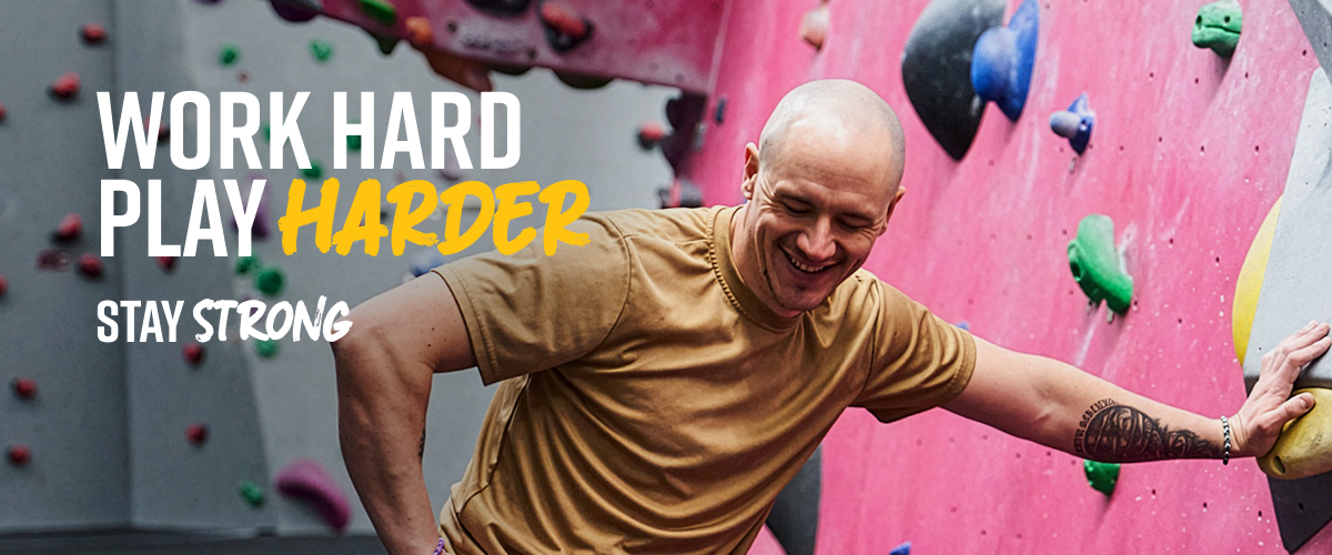 A man bouldering at The Climbing Hangar