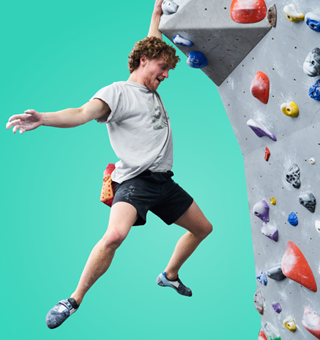 A guy bouldering at The Climbing Hangar