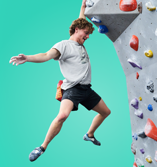 A man bouldering at The Climbing Hangar