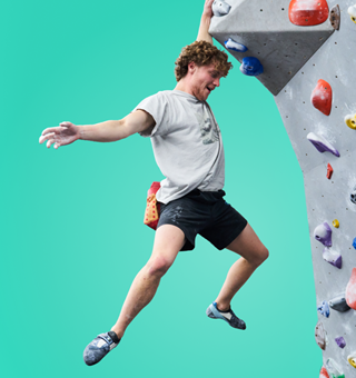 A man bouldering at The Climbing Hangar