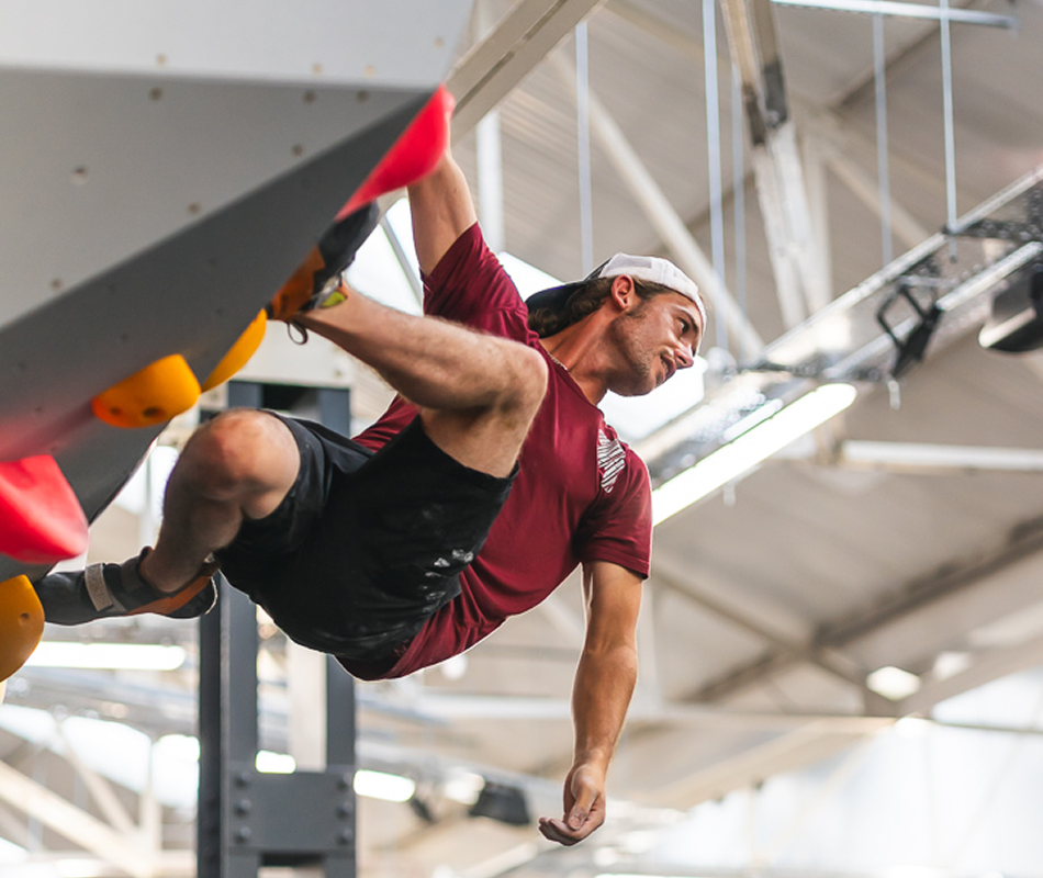 A guy bouldering at The Climbing Hangar